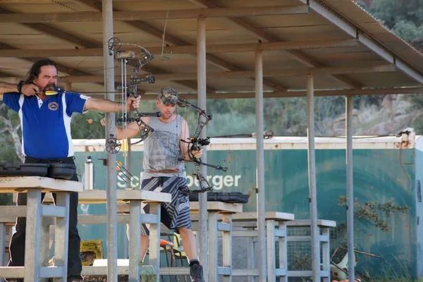 Archers on the covered archery range.